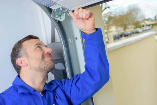 garage-door-technician-installing-a-new-door